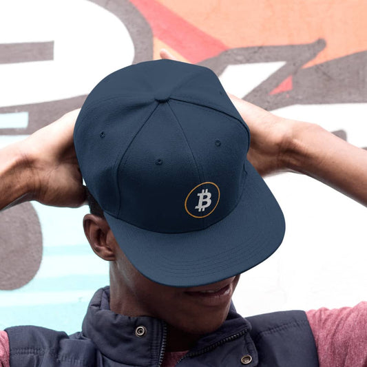 a man wearing a bit swagg stenciled bitcoin snapback hat in navy