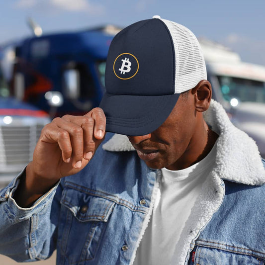 Man wearing a bit swagg stenciled bitcoin trucker cap in navy and white
