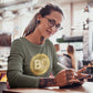 a women in tats wearing a bit swagg bitcoin 2009 logo long sleeve in military green